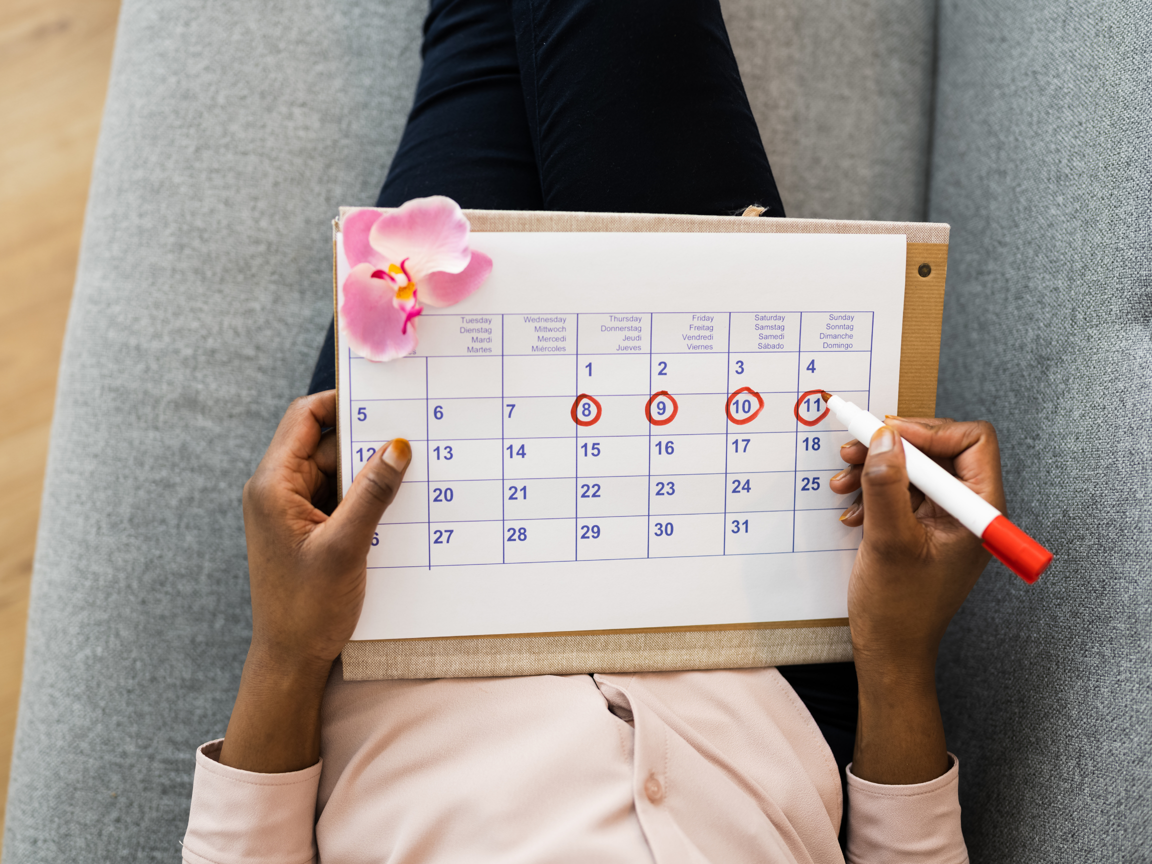 woman circling days in a calendar